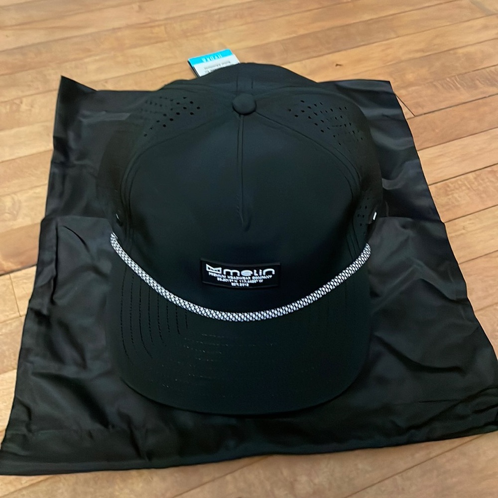 Never worn black Melin Coronado hydro hat - classic size